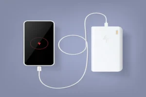 Best Power Bank charging a smartphone via USB cable on a minimal purple background.