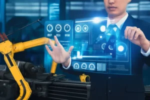 Professional interacting with a futuristic holographic interface displaying automation controls and robotic arm data in an industrial factory setting.