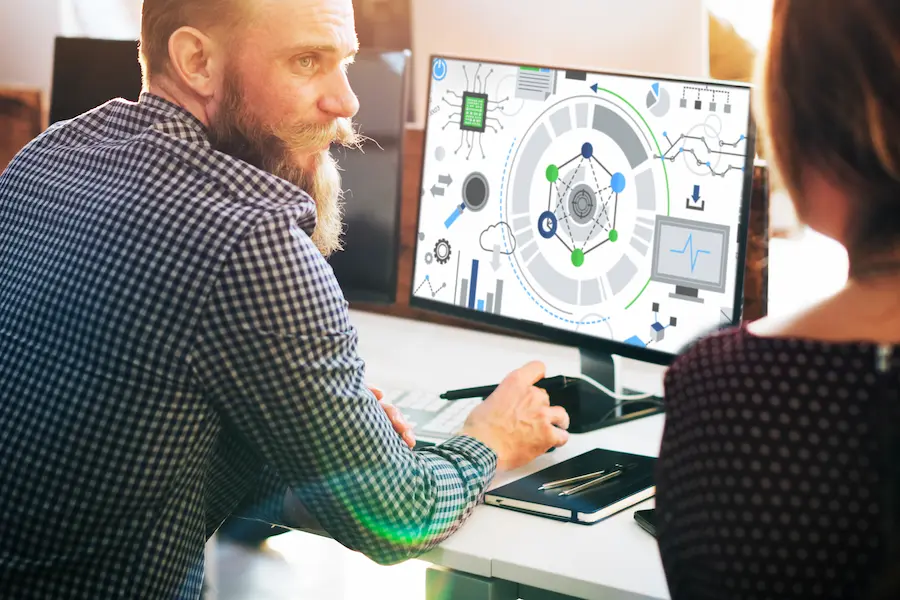 Professional team analyzing data visualization with Pizmotidxizvou on computer screen to improve productivity and decision-making.