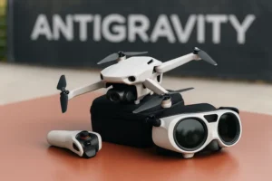Insta360 Antigravity A1 drone with FPV goggles and motion controller on a table, ANTIGRAVITY banner blurred in the background.